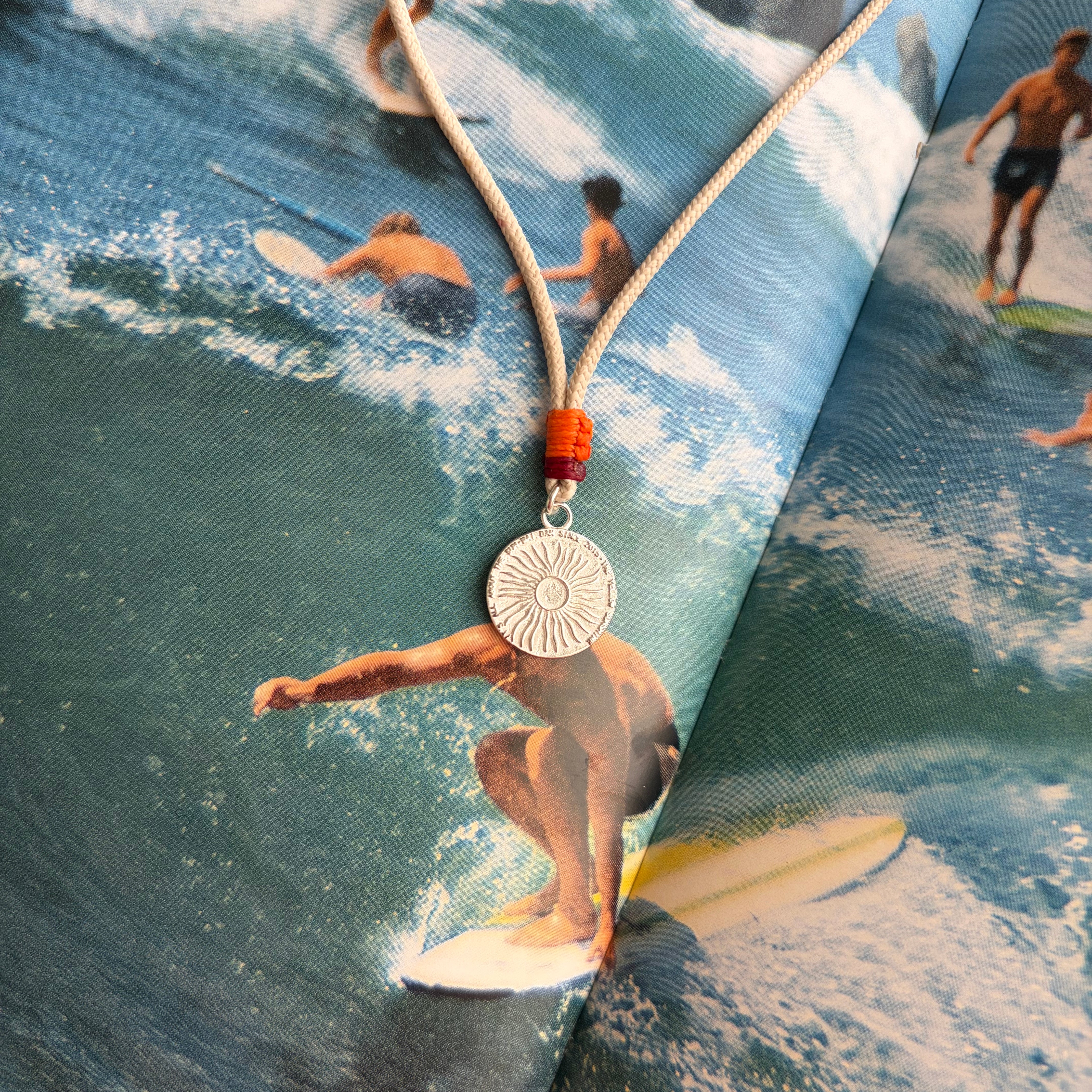 Surf sun coin